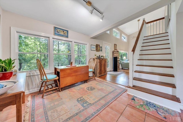 400 E Randolph Pl, Lynchburg, VA 24503 - dining room featuring rail lighting, stairs, lofted ceiling, and tile patterned floors
