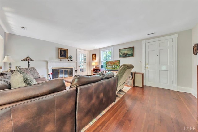 400 E Randolph Pl, Lynchburg, VA 24503 - living room with dark wood finished floors, a glass covered fireplace, and baseboards