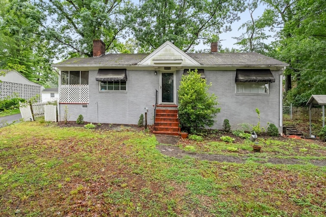 1703 Dale Ave, Altavista, VA 24517 - view of front of home featuring a chimney, brick siding, and entry steps