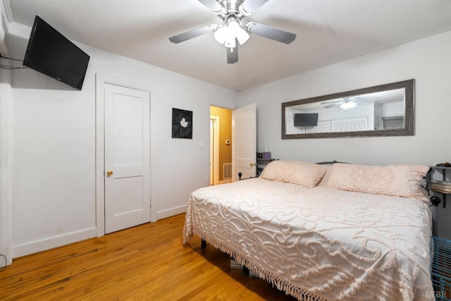 1703 Dale Ave, Altavista, VA 24517 - bedroom featuring wood finished floors, baseboards, and a ceiling fan
