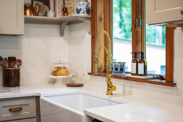 921 Peaksview St, Bedford, VA 24523 - kitchen with tasteful backsplash, a sink, light countertops, and gray cabinetry