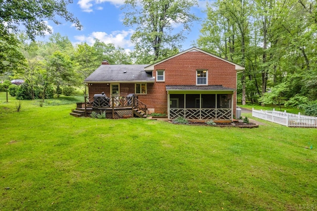 921 Peaksview St, Bedford, VA 24523 - rear view of property with a sunroom, a deck, a chimney, and brick siding