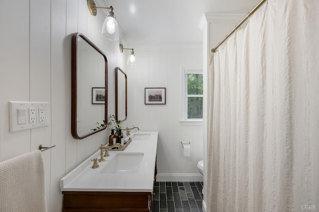 921 Peaksview St, Bedford, VA 24523 - full bathroom with ornamental molding, double vanity, toilet, and baseboards