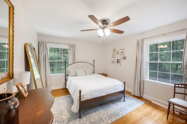 921 Peaksview St, Bedford, VA 24523 - bedroom featuring multiple windows, light wood-type flooring, and baseboards