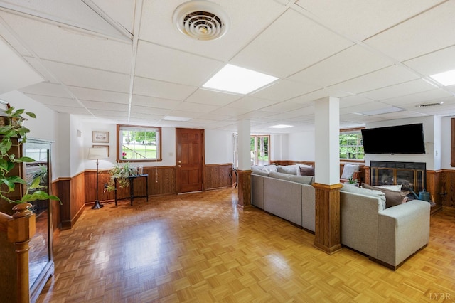 921 Peaksview St, Bedford, VA 24523 - living area with a wainscoted wall, healthy amount of natural light, a paneled ceiling, and wooden walls