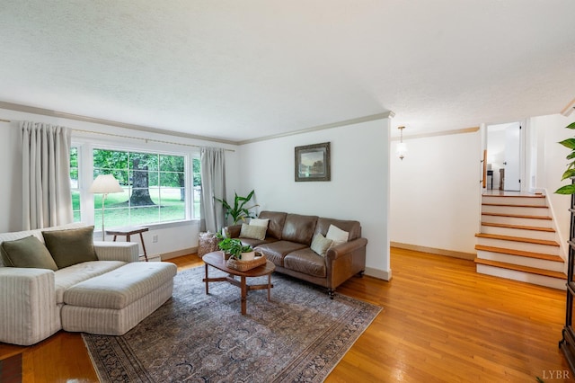 921 Peaksview St, Bedford, VA 24523 - living room featuring ornamental molding, light wood finished floors, stairs, and baseboards