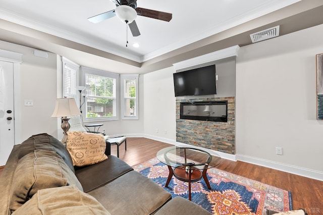 213 Capstone Dr, Lynchburg, VA 24502 - living area featuring ornamental molding, a ceiling fan, wood finished floors, baseboards, and a stone fireplace
