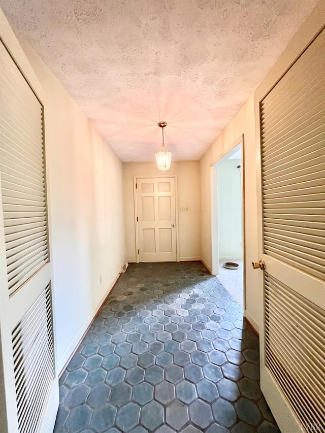 166 Matohe Rd, Monroe, VA 24574 - corridor featuring a chandelier and a textured ceiling