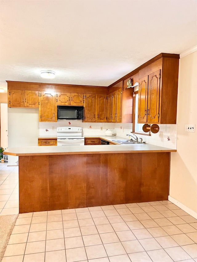 166 Matohe Rd, Monroe, VA 24574 - kitchen with black appliances, brown cabinetry, light countertops, and ornamental molding
