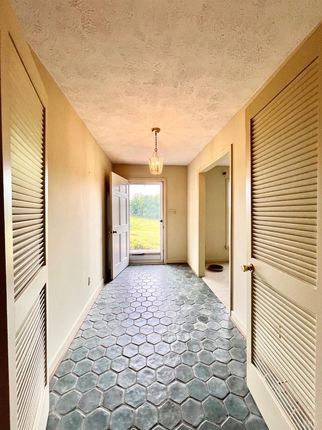 166 Matohe Rd, Monroe, VA 24574 - corridor featuring a chandelier and a textured ceiling