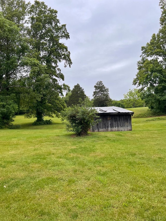 166 Matohe Rd, Monroe, VA 24574 - view of green lawn with an outbuilding