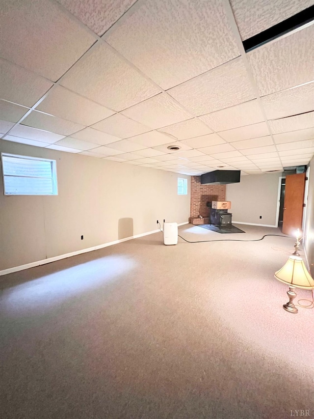 166 Matohe Rd, Monroe, VA 24574 - basement with a drop ceiling, a wood stove, and carpet