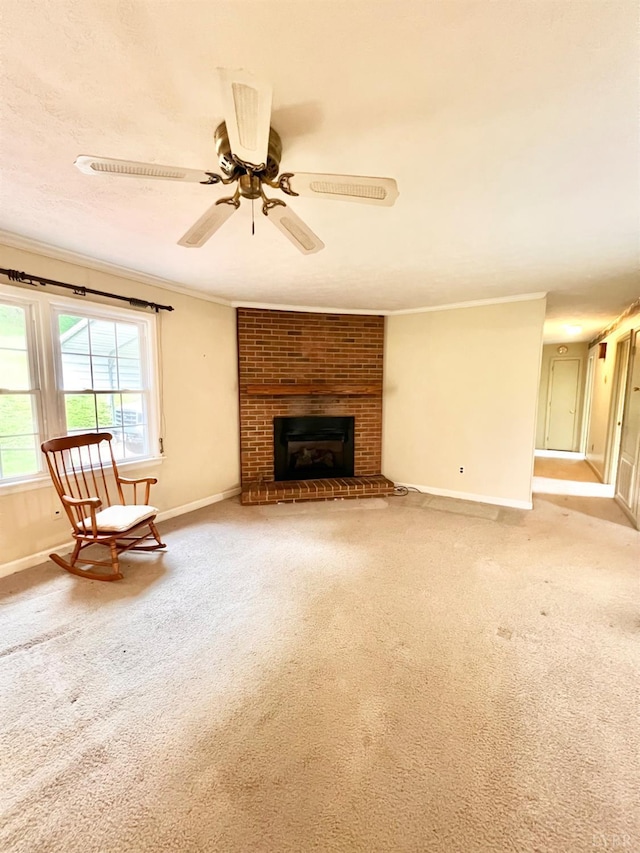166 Matohe Rd, Monroe, VA 24574 - unfurnished living room featuring ornamental molding, light colored carpet, a ceiling fan, and a brick fireplace