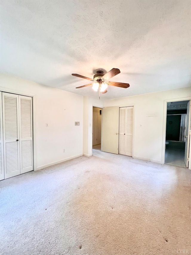 166 Matohe Rd, Monroe, VA 24574 - unfurnished bedroom with light carpet, a ceiling fan, and a textured ceiling