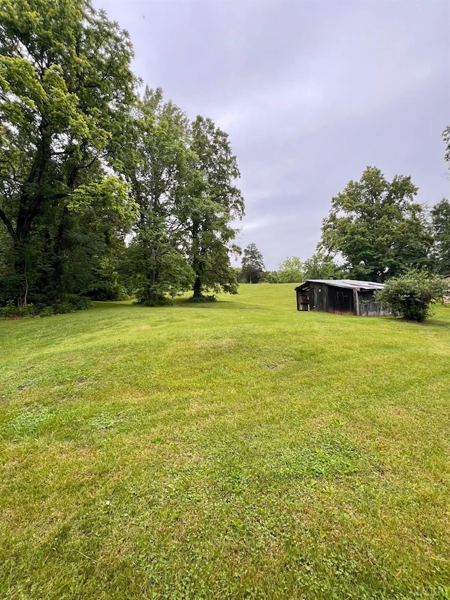 166 Matohe Rd, Monroe, VA 24574 - view of green lawn with an outdoor structure