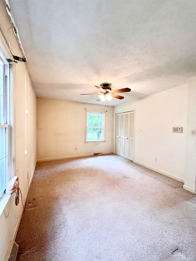 166 Matohe Rd, Monroe, VA 24574 - empty room featuring a textured ceiling, light colored carpet, and ceiling fan