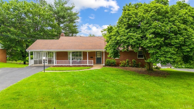 6012 Rhonda Rd, Lynchburg, VA 24502 - single story home featuring a porch, a front lawn, driveway, and a chimney