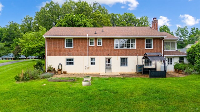 6012 Rhonda Rd, Lynchburg, VA 24502 - rear view of house featuring a chimney, a yard, and brick siding