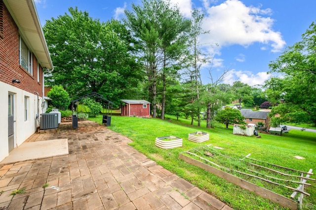 6012 Rhonda Rd, Lynchburg, VA 24502 - view of green lawn with a patio, a garden, central air condition unit, and view of scattered trees
