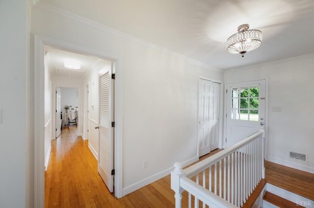 6012 Rhonda Rd, Lynchburg, VA 24502 - hall with attic access, light wood-style flooring, an upstairs landing, crown molding, and baseboards