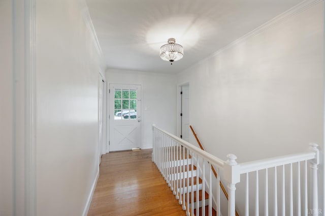 6012 Rhonda Rd, Lynchburg, VA 24502 - hallway featuring an upstairs landing, light wood-style floors, ornamental molding, and a chandelier