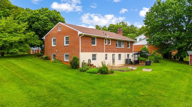 6012 Rhonda Rd, Lynchburg, VA 24502 - rear view of house featuring a lawn, a chimney, central air condition unit, and a patio area