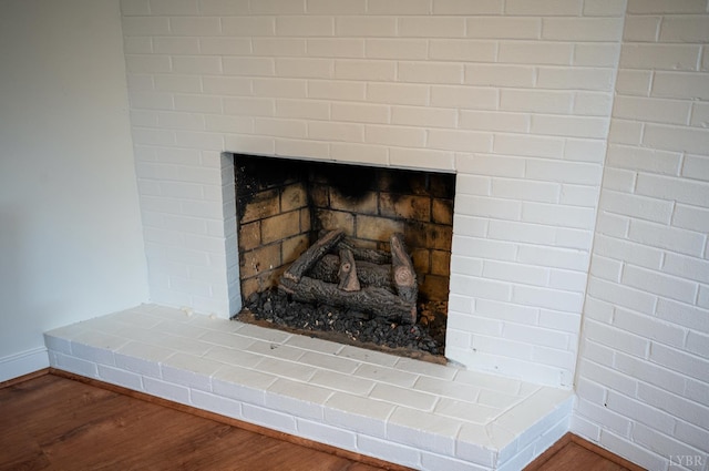 6012 Rhonda Rd, Lynchburg, VA 24502 - detailed view of wood finished floors, baseboards, and a fireplace