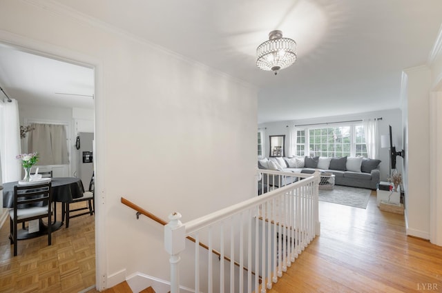 6012 Rhonda Rd, Lynchburg, VA 24502 - hallway with an upstairs landing, a chandelier, ornamental molding, baseboards, and light wood-style flooring