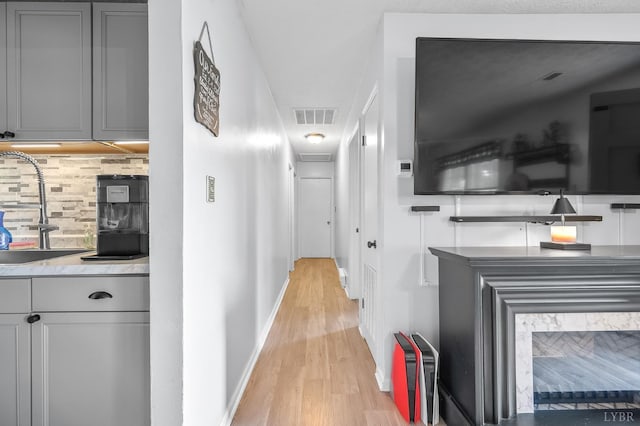 2523 Clarks Rd, Rustburg, VA 24588 - hallway with a sink and light wood-style floors