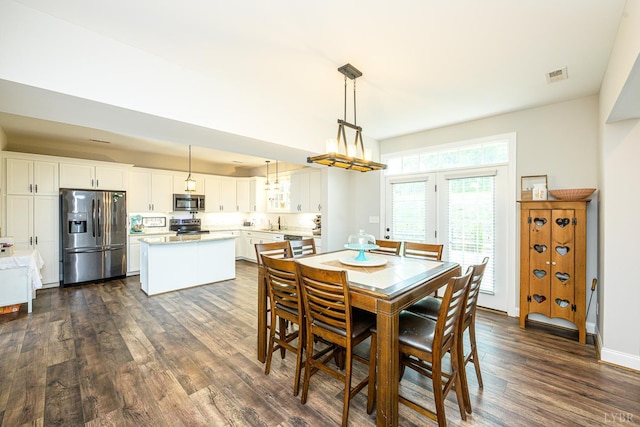 1480 Pilgrim Rd, Goode, VA 24556 - dining room featuring dark wood-style floors