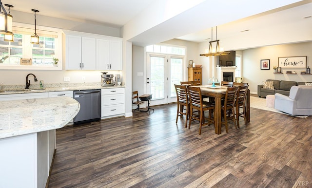 1480 Pilgrim Rd, Goode, VA 24556 - kitchen featuring dishwasher, a sink, open floor plan, dark wood-type flooring, and white cabinetry
