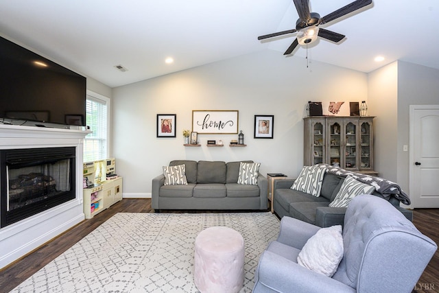 1480 Pilgrim Rd, Goode, VA 24556 - living room with lofted ceiling, dark wood-type flooring, a fireplace, a ceiling fan, and baseboards