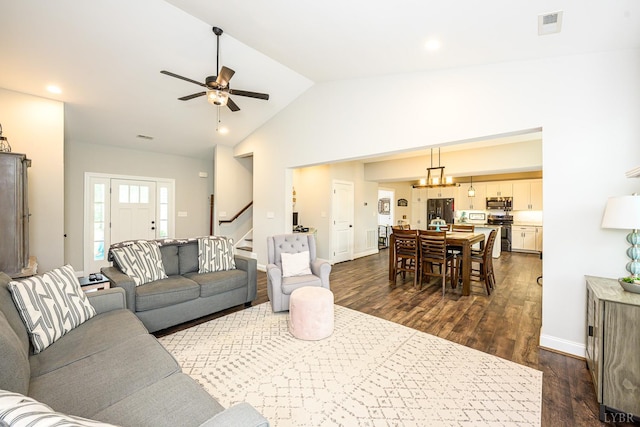 1480 Pilgrim Rd, Goode, VA 24556 - living area with stairs, dark wood-style flooring, a ceiling fan, high vaulted ceiling, and baseboards