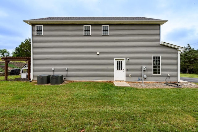 1480 Pilgrim Rd, Goode, VA 24556 - back of property with a lawn and central AC