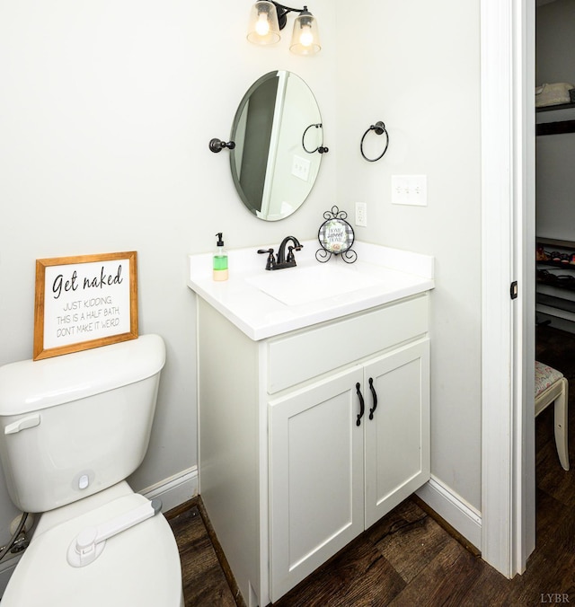 1480 Pilgrim Rd, Goode, VA 24556 - bathroom with toilet, vanity, wood finished floors, and baseboards