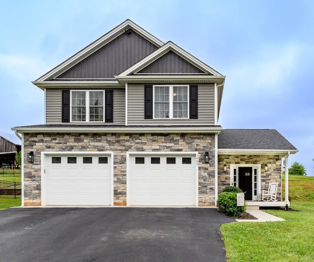 1480 Pilgrim Rd, Goode, VA 24556 - craftsman house featuring driveway, stone siding, a garage, and a front yard