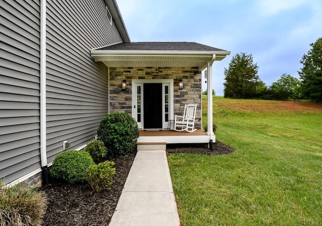 1480 Pilgrim Rd, Goode, VA 24556 - view of exterior entry featuring a lawn, a porch, and stone siding