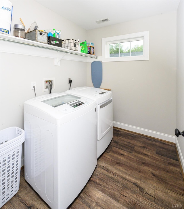 1480 Pilgrim Rd, Goode, VA 24556 - washroom featuring separate washer and dryer, dark wood-style flooring, and baseboards
