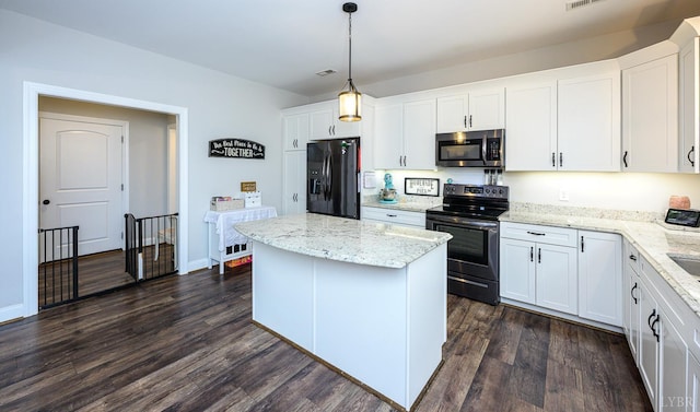 1480 Pilgrim Rd, Goode, VA 24556 - kitchen with stainless steel appliances, a kitchen island, dark wood-style flooring, white cabinetry, and light stone countertops