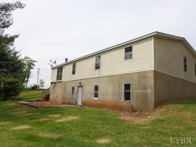 1170 Parrish Rd, Goodview, VA 24095 - back of house with a yard