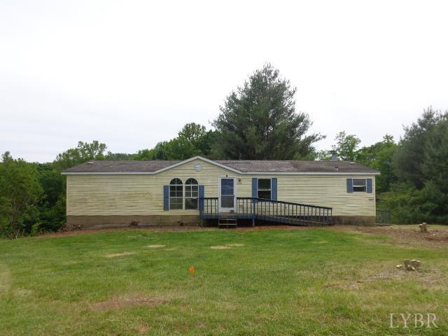 1170 Parrish Rd, Goodview, VA 24095 - view of front of house featuring a front lawn and a deck