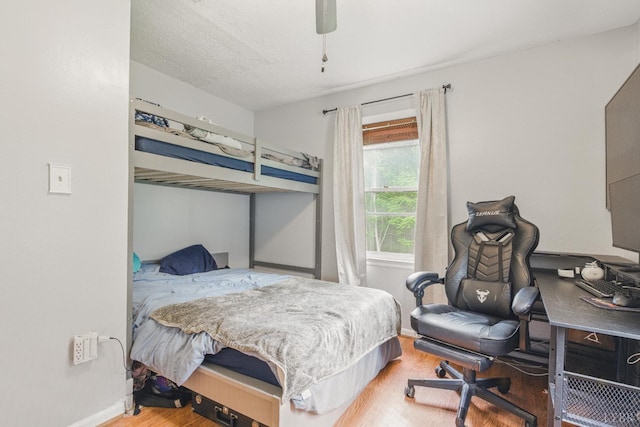 2086 Marshall Mill Rd, Gladys, VA 24554 - bedroom featuring wood finished floors, baseboards, a desk, and a ceiling fan