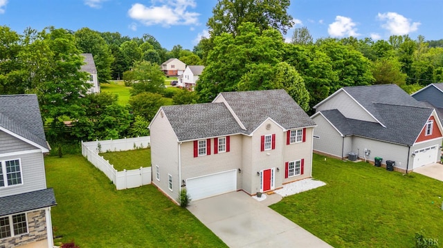 1053 Hupps Hill Ln, Forest, VA 24551 - view of front facade featuring concrete driveway, roof with shingles, a garage, and central AC