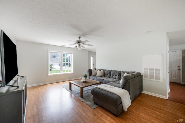 1053 Hupps Hill Ln, Forest, VA 24551 - living room with light wood-style flooring, baseboards, and a ceiling fan
