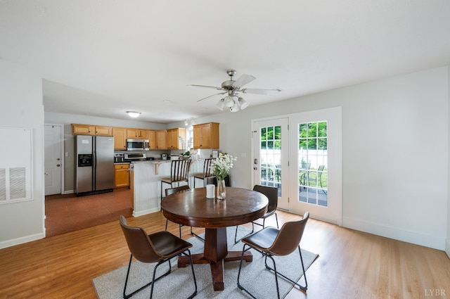 1053 Hupps Hill Ln, Forest, VA 24551 - dining room featuring light wood-style flooring, baseboards, and ceiling fan