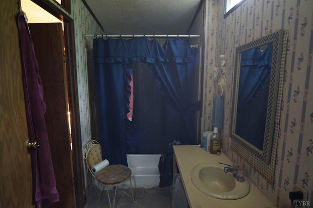 134 Napier Dr, Concord, VA 24538 - bathroom featuring vanity, a textured ceiling, shower / tub combo with curtain, wallpapered walls, and toilet