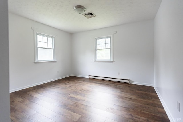 1592 Purdum Mill Rd, Appomattox, VA 24522 - spare room featuring a baseboard radiator, healthy amount of natural light, and dark wood finished floors