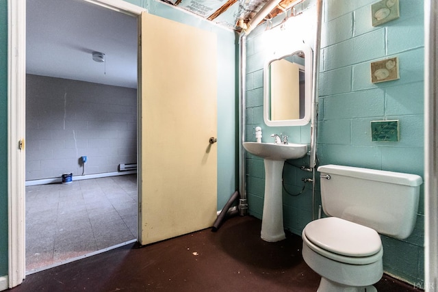 1592 Purdum Mill Rd, Appomattox, VA 24522 - half bathroom featuring concrete floors, toilet, and concrete block wall