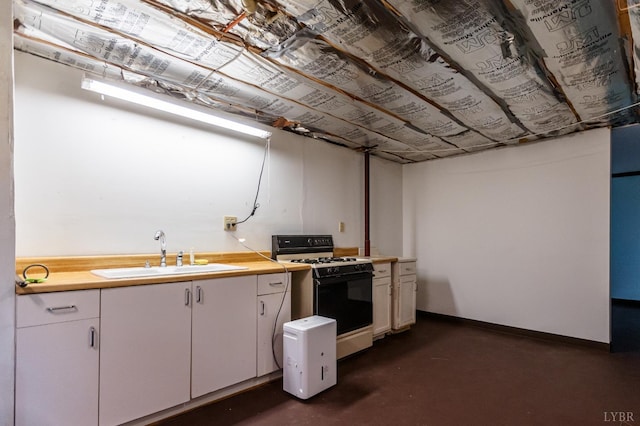 1592 Purdum Mill Rd, Appomattox, VA 24522 - kitchen featuring white range with gas cooktop, a sink, finished concrete floors, light countertops, and baseboards