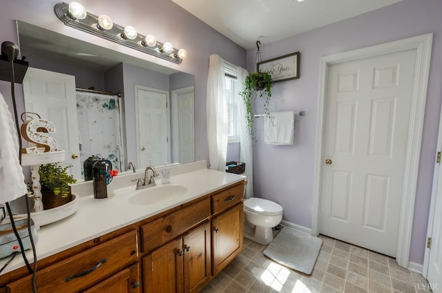 343 Soybean Dr, Appomattox, VA 24522 - bathroom with vanity, toilet, and baseboards